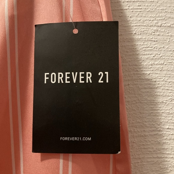 Pink silky mini skirt.   Forever 21 - Picture 2 of 5